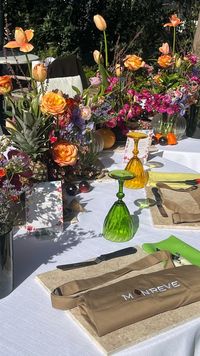 A flower-filled table set for the ARKAS event