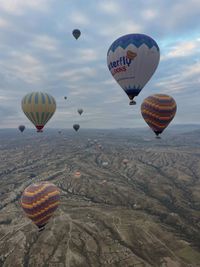 Hot-air balloons drifting over Cappadocia at sunrise